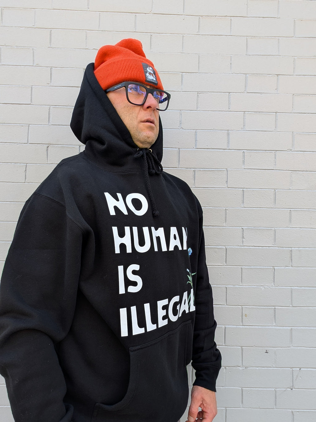 D. NO HUMAN IS ILLEGAL HOODIE