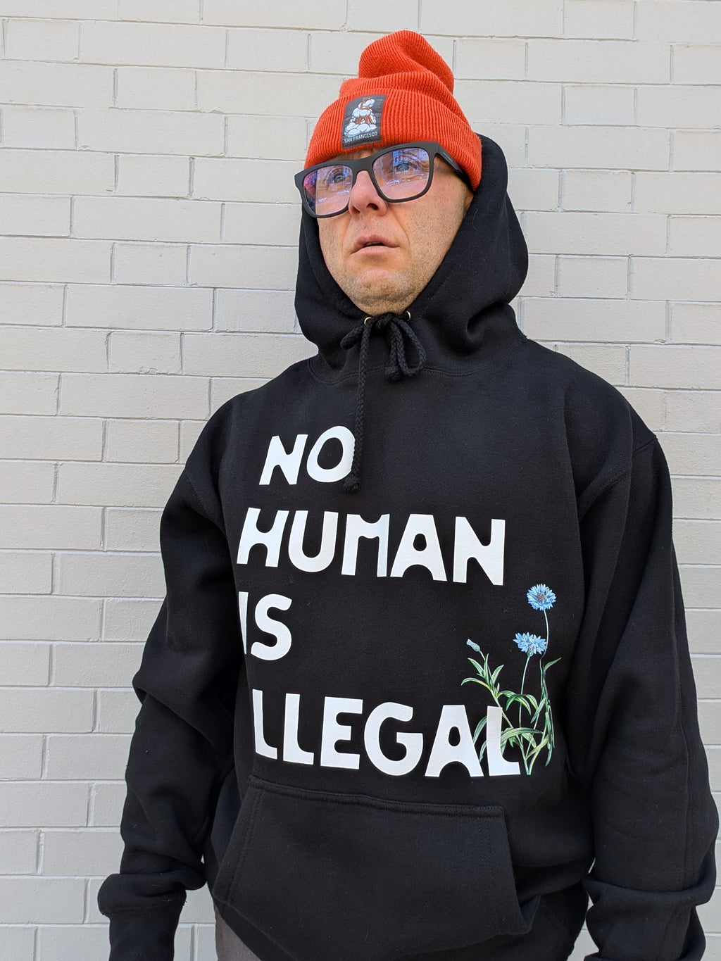 D. NO HUMAN IS ILLEGAL HOODIE